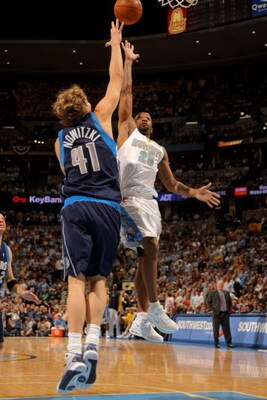DENVER - MAY 13:  Anthony Carter #25 of the Denver Nuggets puts up a shot over Dirk Nowitzki #41 of the Dallas Mavericks in Game Five of the Western Conference Semifinals during the 2009 NBA Playoffs at Pepsi Center on May 13, 2009 in Denver, Colorado.  T