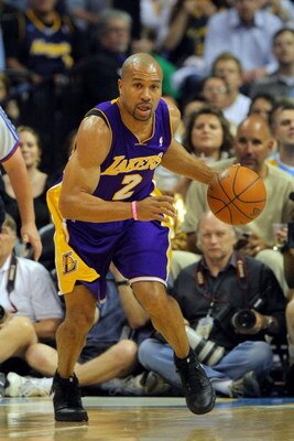 DENVER - MAY 29:  Derek Fisher #2 of the Los Angeles Lakers moves the ball against the Denver Nuggets in Game Six of the Western Conference Finals during the 2009 NBA Playoffs at Pepsi Center on May 29, 2009 in Denver, Colorado. NOTE TO USER: User express