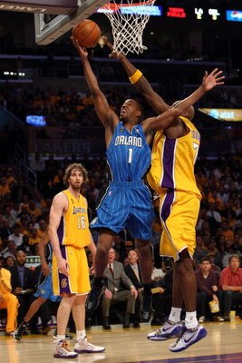 LOS ANGELES, CA - JUNE 04:  Rafer Alston #1 of the Orlando Magic lays the ball up over Lamar Odom #7 and Pau Gasol #16 of the Los Angeles Lakers in Game One of the 2009 NBA Finals at Staples Center on June 4, 2009 in Los Angeles, California. NOTE TO USER:
