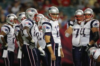 ATLANTA - AUGUST 11:  Quarterback Tom Brady #12 of the New England Patriots looks to the sideline during their NFL preseason game against the Atlanta Falcons on August 11, 2006 at the Georgia Dome in Atlanta, Georgia.  (Photo By Streeter Lecka)