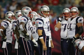 ATLANTA - AUGUST 11:  Quarterback Tom Brady #12 of the New England Patriots looks to the sideline during their NFL preseason game against the Atlanta Falcons on August 11, 2006 at the Georgia Dome in Atlanta, Georgia.  (Photo By Streeter Lecka)