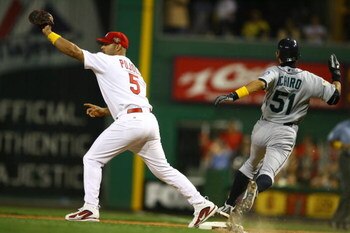 PITTSBURGH - JULY 11:  Outfielder Ichiro Suzuki #51 of the American League All-Star team attempts to step on base before first baseman Albert Pujols #5 of the National League All-Star team can catch the ball during the 77th MLB All-Star Game at PNC Park o