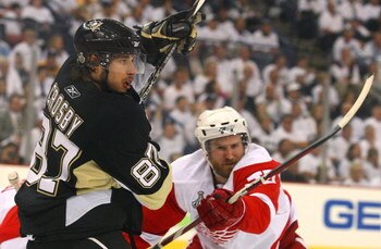 PITTSBURGH - JUNE 04:  Niklas Kronwall #55 of the Detroit Red Wings defends against Sidney Crosby #87 of the Pittsburgh Penguins during Game Four of the 2009 NHL Stanley Cup Finals on June 4, 2009 at Mellon Arena in Pittsburgh, Pennsylvania.  (Photo by Ji