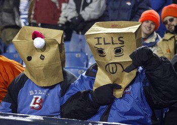 ORCHARD PARK, NY - DECEMBER 17:  Fans of the Buffalo Bills sit with paper bags over their heads during a loss to the Denver Broncos on December 17, 2005 at Ralph Wilson Stadium in Orchard Park, New York. The Broncos defeated the Bills 28-17.  (Photo by Ri