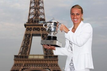 PARIS - JUNE 06:  New ladies French Open champion Svetlana Kuznetsova of Russia poses with the trophy in front of the Eiffel Tower on day fourteen of the French Open on June 6, 2009 in Paris, France.  (Photo by Ryan Pierse/Getty Images)