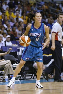 LOS ANGELES - AUGUST 24:  Jennifer Azzi #8 of the Utah Starzz handles the ball in Game two of the Western Conference Finals against the Los Angeles Sparks during the 2002 WNBA Playoffs on August 24, 2002 at Staples Center in Los Angeles, California. The S