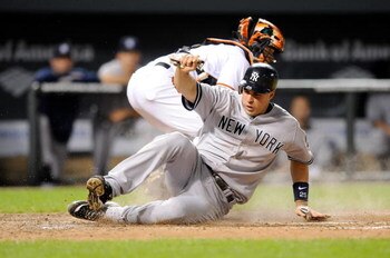 BALTIMORE - MAY 09:  Mark Teixeria #25 of the New York Yankees scores in the fourth inning against the Baltimore Orioles at Oriole Park at Camden Yards on May 9, 2009 in Baltimore, Maryland.  (Photo by Greg Fiume/Getty Images)
