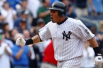 NEW YORK - JUNE 04: Melky Cabrera #53 of the New York Yankees celebrates his two run homer in the 8th inning against the Texas Rangers during their game on June 4, 2009 at Yankee Stadium in the Bronx borough of New York City.  (Photo by Chris McGrath/Gett