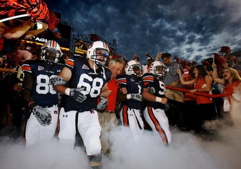 AUBURN, AL - SEPTEMBER 20: Offensive lineman Jason Bosley #68 of the Auburn Tigers leads head coach Tommy Tuberville and the rest of his team out of the tunnel before taking on the LSU Tigers missed a field goal at Jordan-Hare Stadium on September 20, 200
