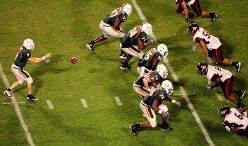 MIAMI - NOVEMBER 13:  Quarterback Robert Marve #9 of the Miami Hurricanes takes a snap in the third quarter while taking on the Virginia Tech Hokies at Dolphin Stadium on November 13, 2008 in Miami, Florida. Miami defeated Virginia Tech 16-14.  (Photo by 