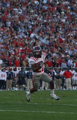 DALLAS - JANUARY 02:  Wide receiver Dexter McCluster #22 of the Mississippi Rebels runs the ball against the Texas Tech Red Raiders during the AT&T Cotton Bowl on January 2, 2009 at the Cotton Bowl in Dallas, Texas.  (Photo by Ronald Martinez/Getty Images