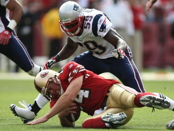 SAN FRANCISCO - OCTOBER 05: Gary Guyton #59 of the New England Patriots tackles quarterback J.T. O'Sullivan #14 of the San Francisco 49ers during an NFL game on October 5, 2008 at Candlestick Park in San Francisco, California.  (Photo by Jed Jacobsohn/Get