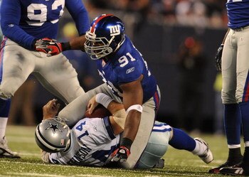 EAST RUTHERFORD, NJ - NOVEMBER 02:  Justin Tuck #91 of the New York Giants sacks Brad Johnson #14 of the Dallas Cowboys during their game on November 2, 2008 at Giants Stadium in East Rutherford, New Jersey.  (Photo by Al Bello/Getty Images)