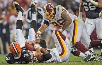 LANDOVER, MD - OCTOBER 19: Quarterback Derek Anderson #3 of the Cleveland Browns gets sacked by defensive end Andre Carter #99 and defensive tackle Cornelius Griffin #96 of the Washington Redskins on October 19, 2008 at FedEx Field in Landover, Maryland. 