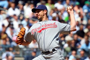 NEW YORK - APRIL 16:  Cliff Lee #31 of the Cleveland Indians pitches against the New York Yankees during opening day at the new Yankee Stadium on April 16, 2009 in the Bronx borough of New York City. This is the first regular season MLB game being played 