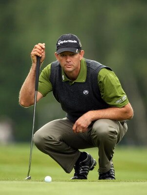 WENTWORTH, ENGLAND - MAY 21:  Retief Goosen of South Africa lines up a putt on the 6th green during the First Round of the BMW PGA Championship at Wentworth on May 21, 2009 in Virginia Water, England.  (Photo by Ross Kinnaird/Getty Images)