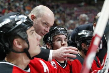 EAST RUTHERFORD, NJ - FEBRUARY 14:  Assistant coach John MacLean of the New Jersey Devils instructs his players during the game against the Montreal Canadiens at Continental Airlines Arena on February 14, 2007 in East Rutherford, New Jersey. The Devils wo