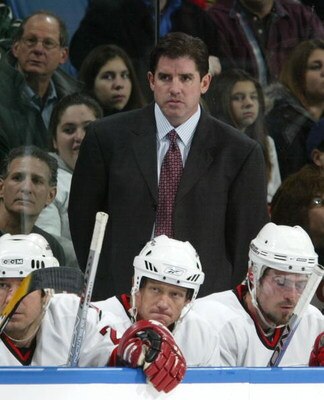 UNIONDALE, NY - NOVEMBER 22:  Head coach Peter Laviolette of the Carolina Hurricanes looks on against the New York Islanders on November 22, 2006 at Nassau Coliseum in Uniondale, New York.  (Photo by Jim McIsaac/Getty Images)