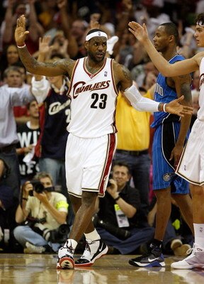 CLEVELAND - MAY 28:  LeBron James #23 of the Cleveland Cavaliers high fives with teammate Anderson Varejao #17 after a play against the Orlando Magic in Game Five of the Eastern Conference Finals during the 2009 Playoffs at Quicken Loans Arena on May 28, 