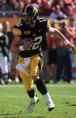 TAMPA, FL - JANUARY 01:  Ricky Stanzi #12 of the Iowa Hawkeyes runs upfield against the South Carolina Gamecocks during the Outback Bowl on January 1, 2009 at Raymond James Stadium in Tampa, Florida.  (Photo by Scott Halleran/Getty Images)
