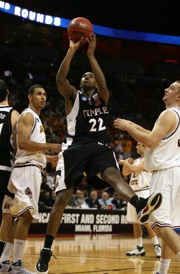 MIAMI - MARCH 20:  Guard Dionte Christmas #22 (C)  of the Temple Owl  drives to the basket past  forward Jeff Pendergraph #3  (L) and forward Rihards Kuksiks #30 (R) of the Arizona State Sun Devils during the first round of the NCAA Division I Men's Baske