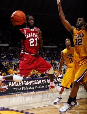 BATON ROUGE, LA - JANUARY 26:  Patrick Beverley #21 of the Arkansas Razorbacks passes the ball around Quinton Thornton #32 of the Louisiana State University Tigers on January 26, 2008 at the Pete Maravich Assembly Center in Baton Rouge, Louisiana.  (Photo