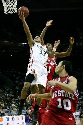 CHARLOTTE, NC - MARCH 13:  Jack McClinton #33 of the Miami Hurricanes shoots in front of Gavin Grant #11 of the North Carolina Wolfpack during Day 1 of the 2008 Men's ACC Basketball Tournament at Bobcats Arena on March 13, 2008 in Charlotte, North Carolin