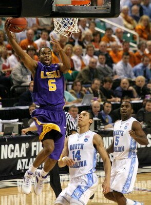 GREENSBORO, NC - MARCH 21:  Marcus Thornton #5 of the Louisiana State University Tigers lays in a basket against Danny Green #14 of the North Carolina Tar Heels during the second round of the NCAA Division I Men's Basketball Tournament at the Greensboro C