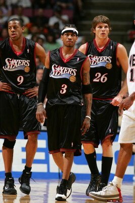 EAST RUTHERFORD, NJ - APRIL 17:  (Left to Right) Andre Iguodala #9 of the Philadelphia 76ers walks with his teammates Allen Iverson #3 and Kyle Korver #26 during the game against the New Jersey Nets on April 17, 2005 at Continental Airlines Arena in East 