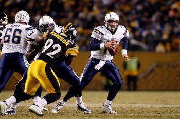 PITTSBURGH - JANUARY 11:  Philip Rivers #17 of the San Diego Chargers rolls out to pass against James Harrison #92 of the Pittsburgh Steelers during their AFC Divisional Playoff Game on January 11, 2009 at Heinz Field in Pittsburgh, Pennsylvania.  (Photo 