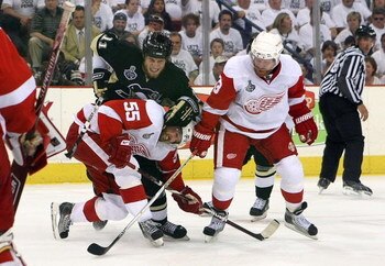 PITTSBURGH - JUNE 9:  Jordan Staal #11 of the Pittsburgh Penguins battles for the puck with Niklas Kronwall #55 and Kris Draper #33 of the Detroit Red Wings during Game Six of the 2009 NHL Stanley Cup Finals at the Mellon Arena on June 9, 2009 in Pittsbur