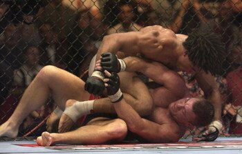 LONDON - JULY 13:  Carlos Newton of Canada battles with Matt Hughes of the USA during the Ultimate Fighting Championship, 'Brawl in the Royal Albert Hall', in the Royal Albert Hall London, England on July 13, 2002. (Photo by John Gichigi/Getty Images)