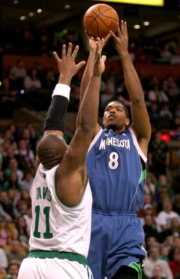 BOSTON - FEBRUARY 01:  Ryan Gomes #8 of Minnesota Timberwolves takes a shot as Glen Davis #11 of the Boston Celtics defends on February 1, 2009 at TD Banknorth Garden in Boston, Massachusetts. NOTE TO USER: User expressly acknowledges and agrees that, by 