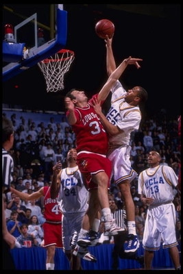 27 Jan 1996:  Forward Beau Zach Smith #33 of the Louisville Cardinals attempts to block a slam by forward J.R. Henderson #57 of UCLA Bruins at Pauley Pavilion in Los Angeles, California.  Louisville defeated UCLA 78-76.  Mandatory Credit:  Steve Dunn/Alls