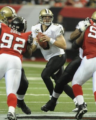 ATLANTA - NOVEMBER 9: Quarterback Drew Brees #9 of the New Orleans Saints sets to pass against the Atlanta Falcons at the Georgia Dome on November 9, 2008 in Atlanta, Georgia.  (Photo by Al Messerschmidt/Getty Images) 