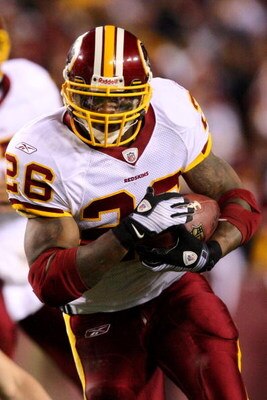 LANDOVER, MD - NOVEMBER 16:  Clinton Portis #26 of the Washington Redskins runs after being handed off the ball by teammate Jason Campbell #17 during the game against the Dallas Cowboys on November 16, 2008 at FedEx Field in Landover, Maryland.  (Photo by
