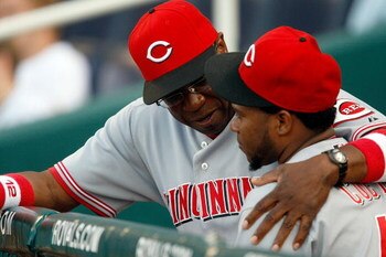 KANSAS CITY, MO - JUNE 12:   Manager Dusty Baker #12 of the Cincinnati Reds talks with Johnny Cueto #47 prior to the start of the game against  the Kansas City Royals on June 12, 2009 at Kauffman Stadium in Kansas City, Missouri.  (Photo by Jamie Squire/G
