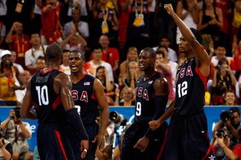BEIJING - AUGUST 24: Kobe Bryant #10 of the United States celebrate a play with teammates Chris Paul #13, Dwyane Wade #9 and Chris Bosh #12 in the gold medal game against Spain during Day 16 of the Beijing 2008 Olympic Games at the Beijing Olympic Basketb