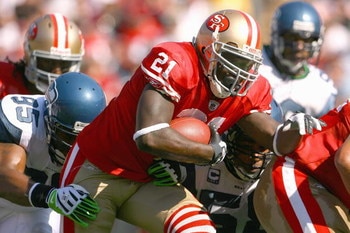 SAN FRANCISCO - OCTOBER 26:  Frank Gore #21 of the San Francisco 49ers carries the ball the game against Lawrence Jackson #95 of the Seattle Seahawks at Candlestick Park on October 26, 2008 in San Francisco, California. (Photo by: Jeff Gross/Getty Images)