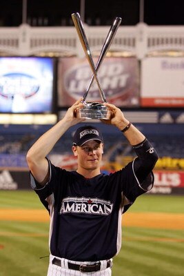 NEW YORK - JULY 14:  Justin Morneau of the Minnesota Twins  holds the trophy for the 2008 MLB All-Star State Farm Home Run Derby at Yankee Stadium on July 14, 2008 in the Bronx borough of New York City.  (Photo by Jim McIsaac/Getty Images)