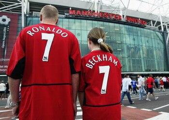 MANCHESTER - AUGUST 16:  Manchester United fans wearing new boy Cristiano Ronaldo and recently departed David Beckham shirts during the FA Barclaycard Premiership match between Manchester United and Bolton Wanderers held on August 16, 2003 at Old Trafford