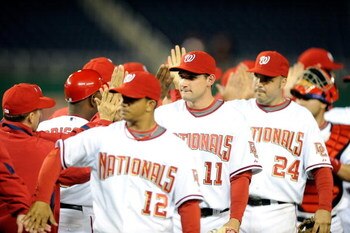 WASHINGTON - APRIL 20:  Ryan Zimmerman #11 of the Washington Nationals celebrates with teammates after a 3-2 victory against the Atlanta Braves at Nationals Park on April 20, 2009 in Washington, DC.  (Photo by Greg Fiume/Getty Images)