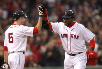 BOSTON - JUNE 11: David Ortiz #34 of the Boston Red Sox hits a home run and celebrates with teammate Rocco Baldelli against the New York Yankees at Fenway Park on June 11, 2009 in Boston, Massachusetts. (Photo by Jim Rogash/Getty Images)