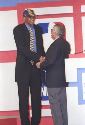25 Jun 1997:  Forward Tony Battie of the Denver Nuggets shakes hands with NBA Commissioner David Stern during the NBA Draft at the Charlotte Coliseum in Charlotte, North Carolina. Mandatory Credit: Craig Jones  /Allsport