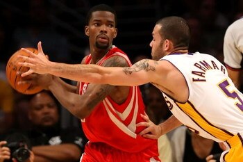 LOS ANGELES, CA - MAY 17:  Aaron Brooks #0 of the Houston Rockets looks to pass as he is covered by Jordan Farmar #5 of the Los Angeles Lakers in Game Seven of the Western Conference Semifinals during the 2009 NBA Playoffs at Staples Center on May 17, 200