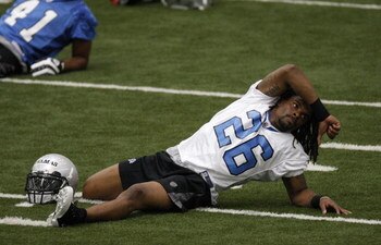 ALLEN PARK, MI - MAY 01: Louis Delmas #26 of the Detroit Lions stretches during rookie orientation camp at the Detroit Lions Headquarters and Training Facility on May 1, 2009 in Allen Park, Michigan.  (Photo by Gregory Shamus/Getty Images)
