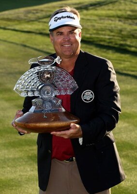 SCOTTSDALE, AZ - FEBRUARY 1:  Kenny Perry poses with the trophy after his victory on the third playoff hole during the final round of the FBR Open on February 1, 2009 at TPC Scottsdale in Scottsdale, Arizona.  (Photo by Stephen Dunn/Getty Images)