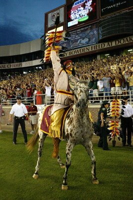 TALLAHASSEE, FL - SEPTEMBER 05:  FSU mascot Chief Osceola and his horse Renegade of the Florida State Seminoles pumps up the crowd to start the game against the Miami Hurricanes at Doak Campbell Stadium on September 5, 2005 in Tallahassee, Florida.  (Phot