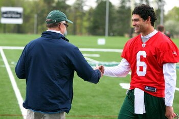 FLORHAM PARK, NJ - MAY 02:  Quarterback Mark Sanchez #6 of the New York Jets talks with team owner Woody Johnson during minicamp on May 2, 2009 at the Atlantic Health Jets Training Center in Florham Park, New Jersey.  (Photo by Jim McIsaac/Getty Images)