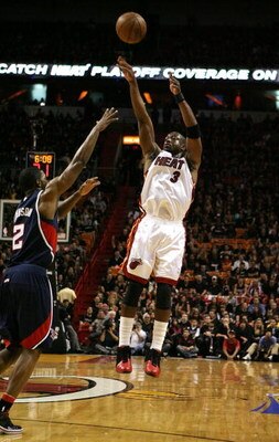 MIAMI - APRIL 25:  Dwyane Wade #3 of the Miami Heat shoots over Joe Johnson #2 of the Atlanta Hawks during Game Three of the Eastern Conference Quarterfinals at American Airlines Arena on April 25, 2009 in Miami, Florida. The Heat defeated the Hawks 107-7